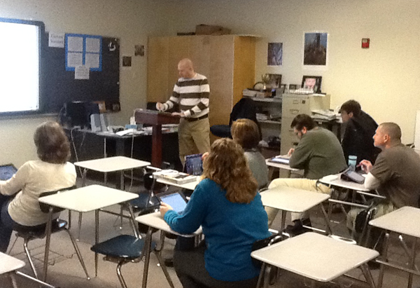 Mr. Anderson uses his iPad in class